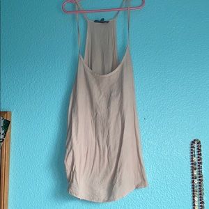 Brand is Don’t Ask Why that is a tan tank top